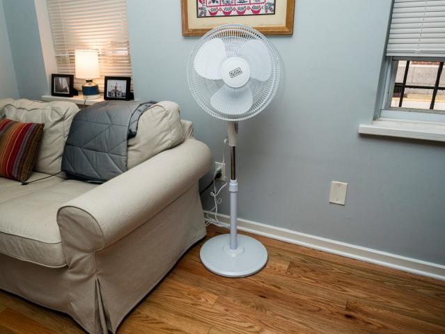 Stainless Steel Air Circulator On A Pedestal: Enhancing Workplace Comfort
